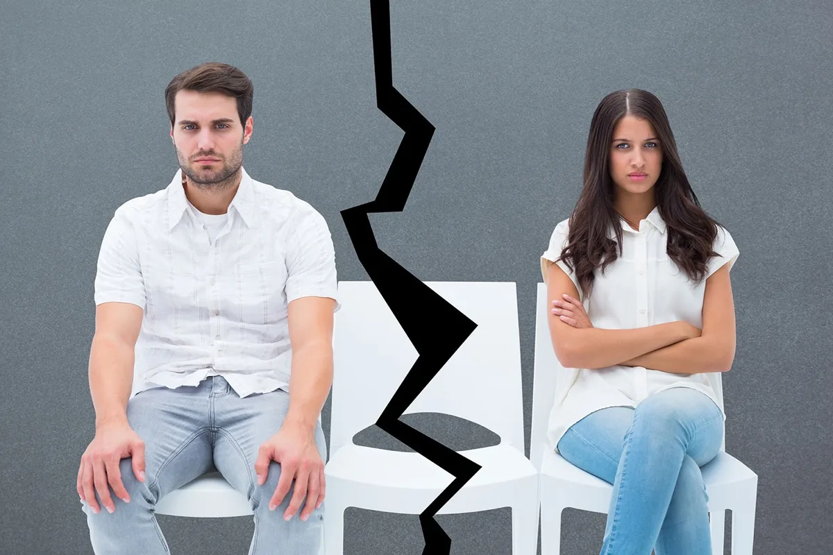 A couple sitting apart after a marriage breakup